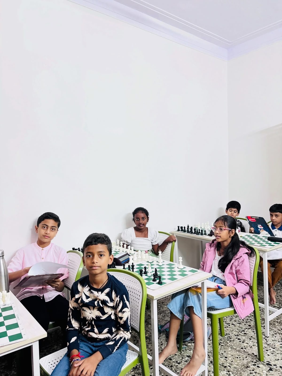 Students gathered for a group chess training session