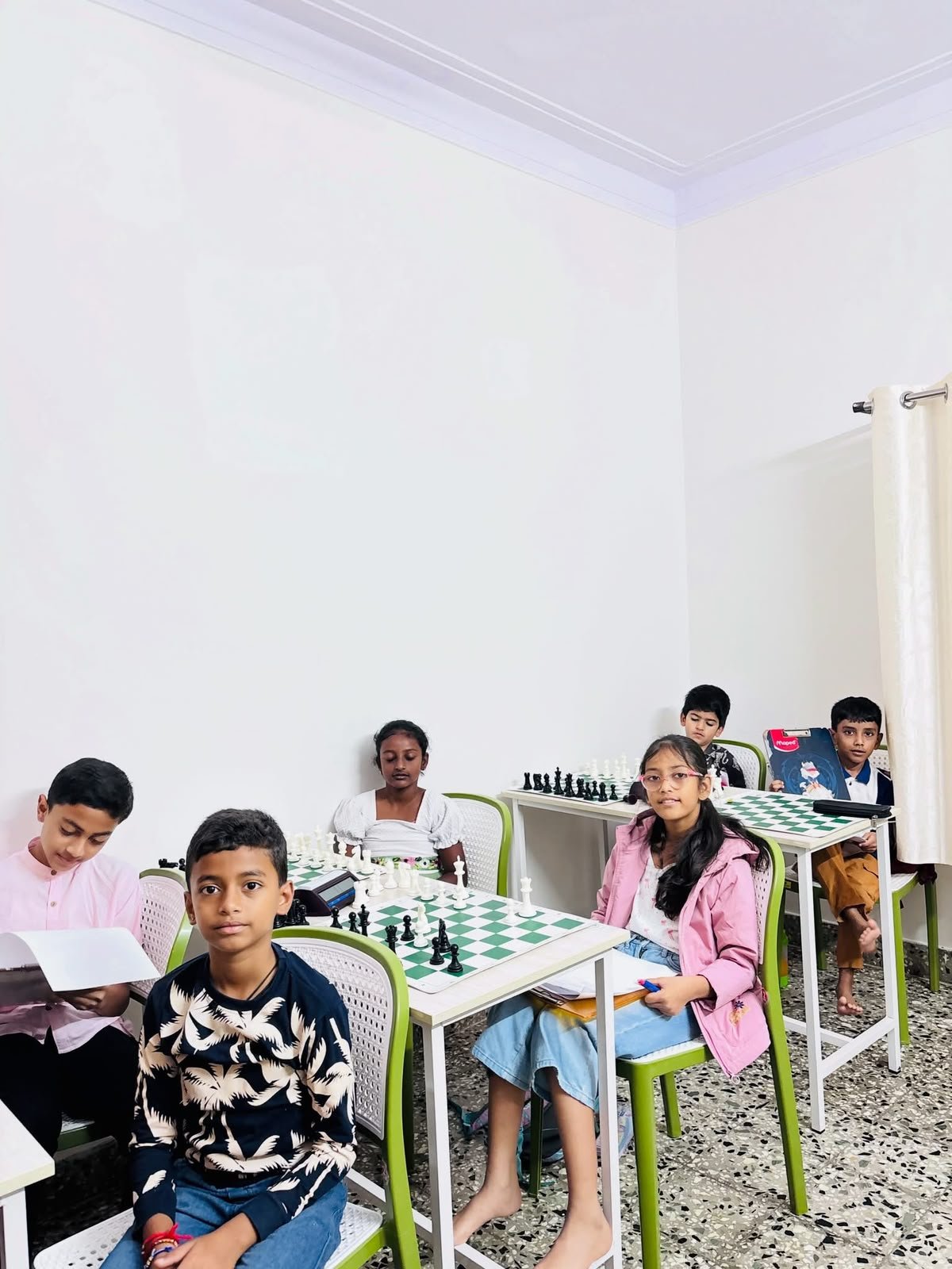 Students participating in a structured group chess class