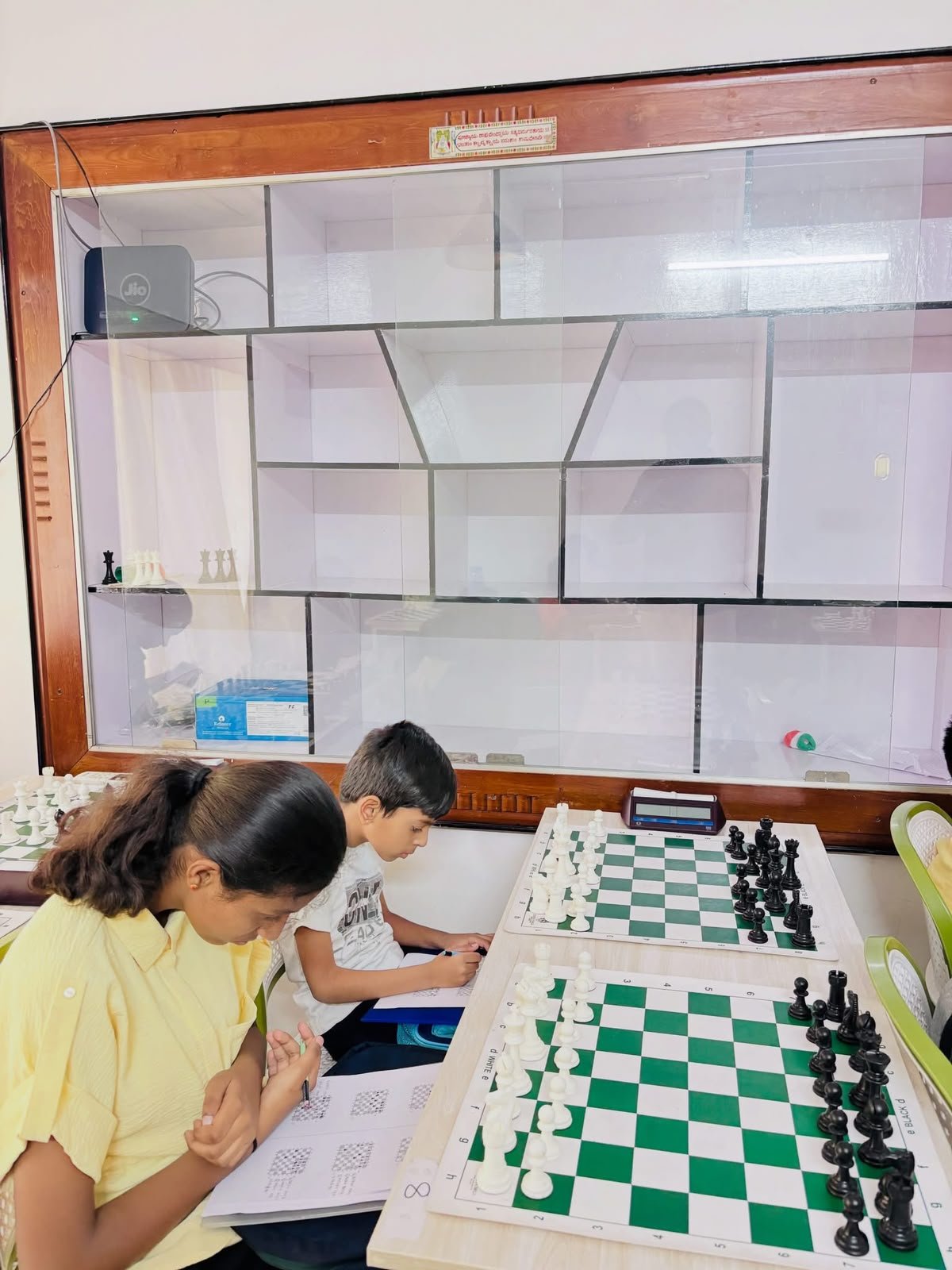 Students working on chess notation and practice positions