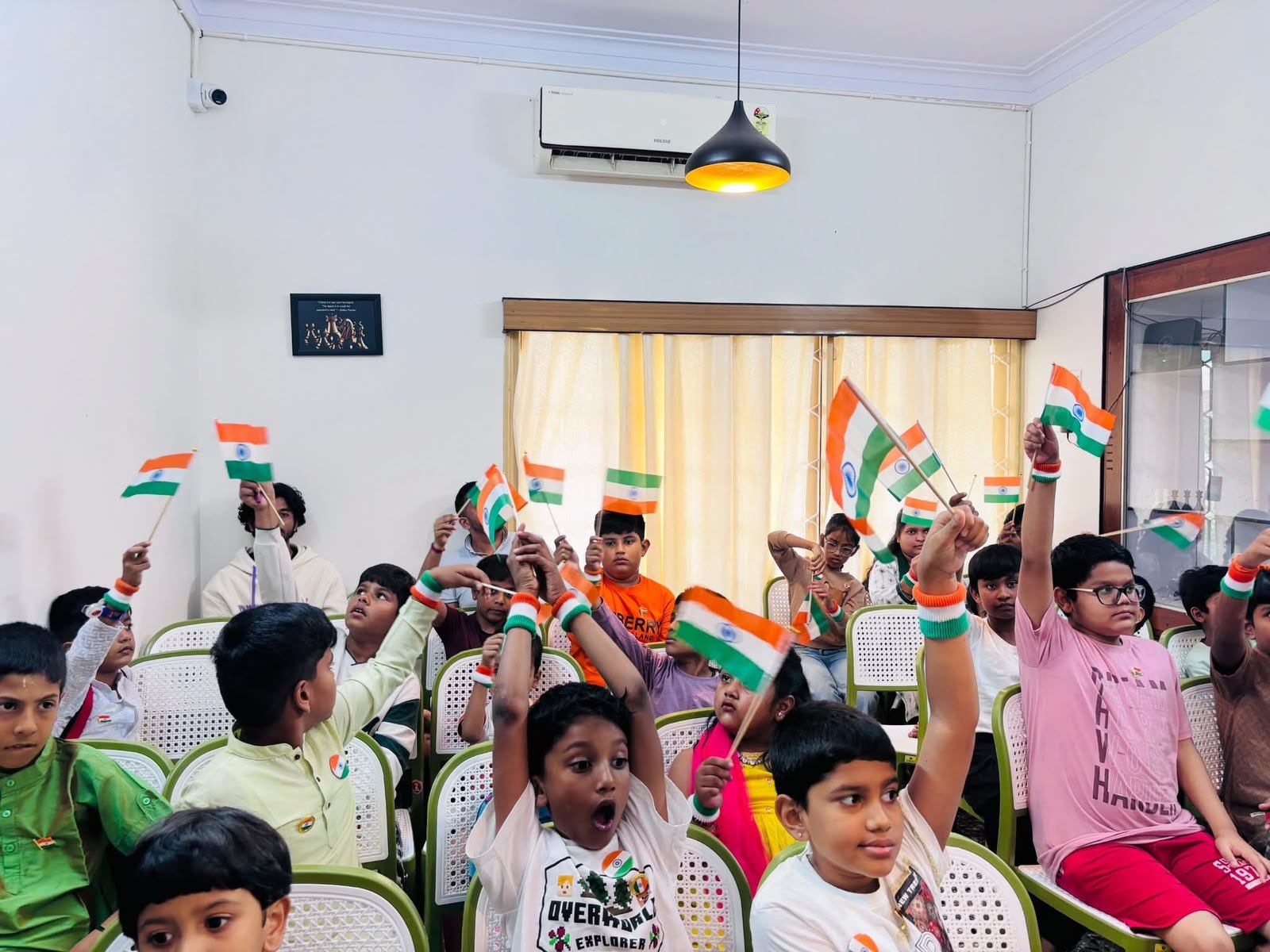 Students celebrating Independence Day with Indian flags at The Chess Forge